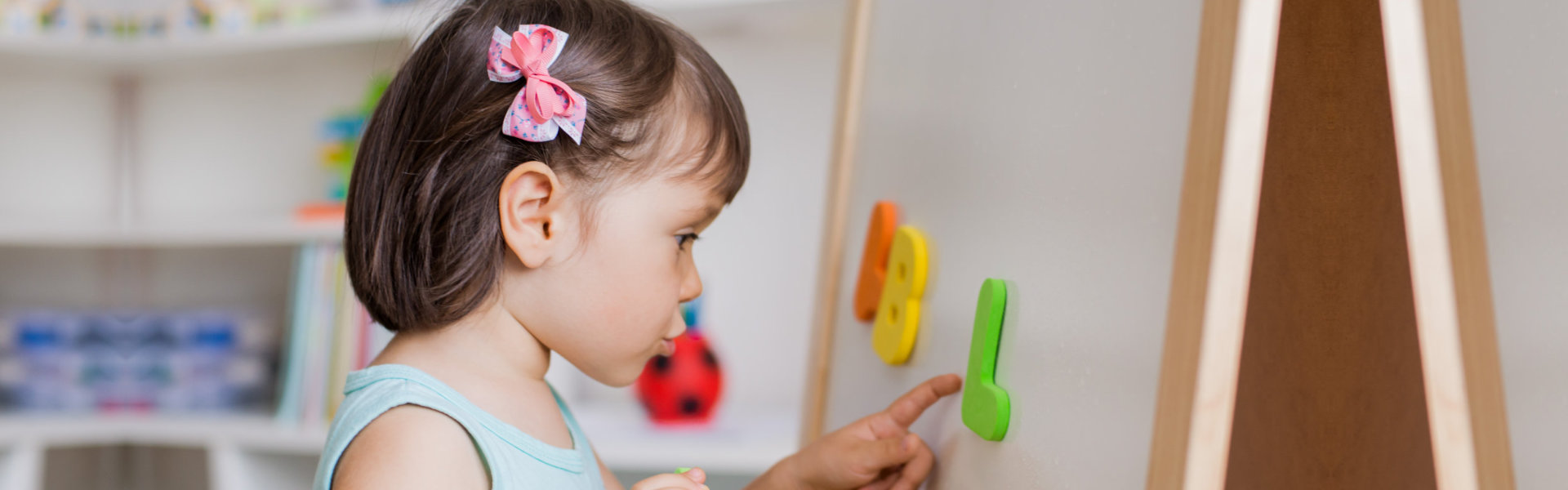 child playing with letters