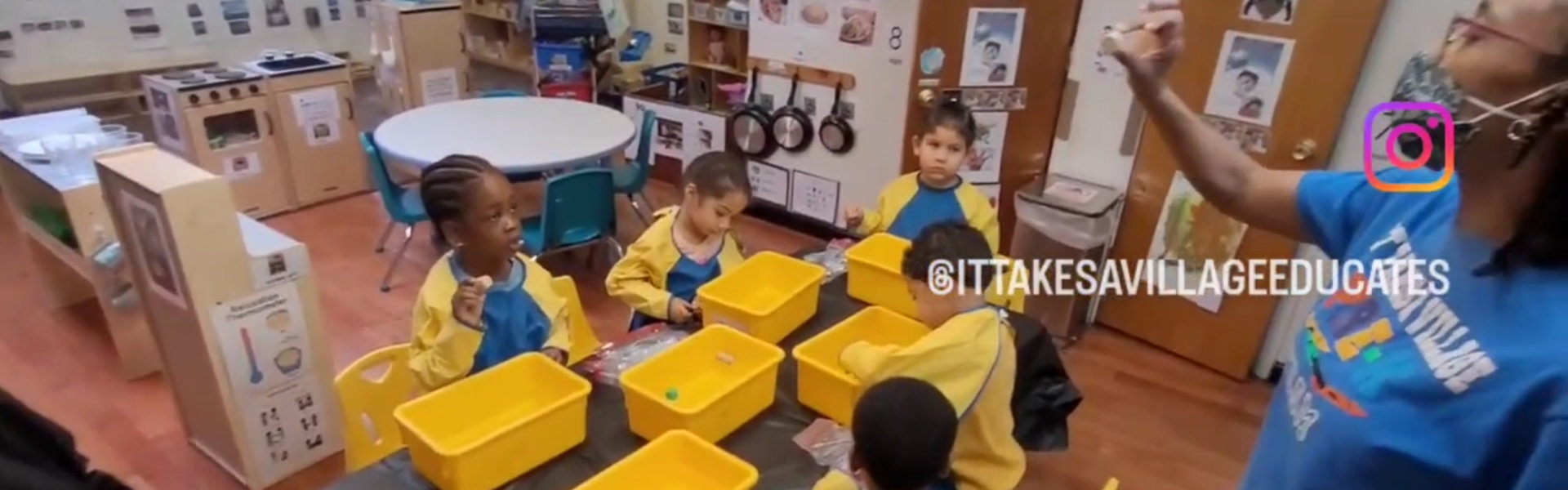 teacher with students with yellow buckets